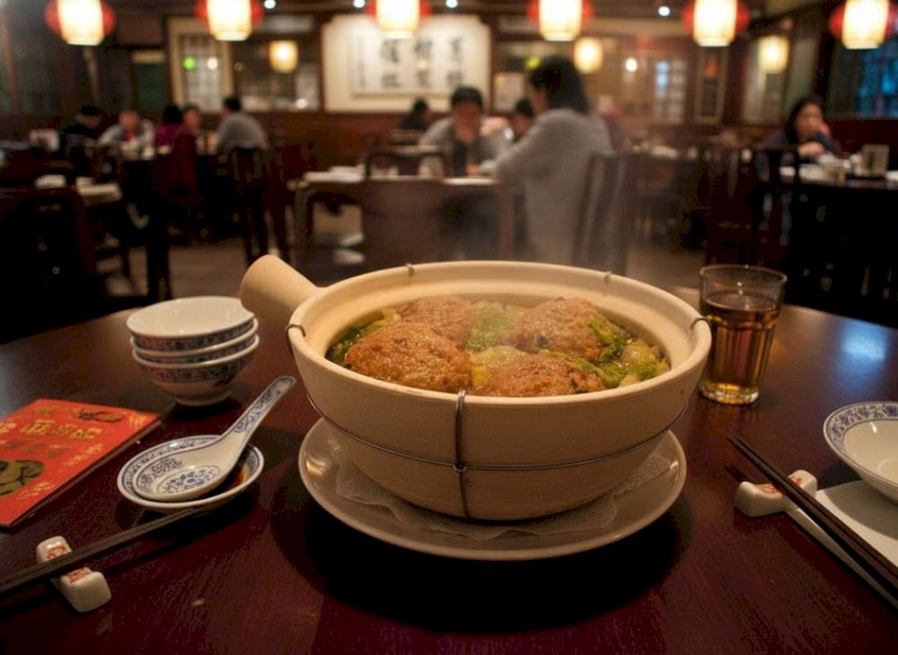 Shīzi Tóu is a dish with large meatballs cooked in a light broth